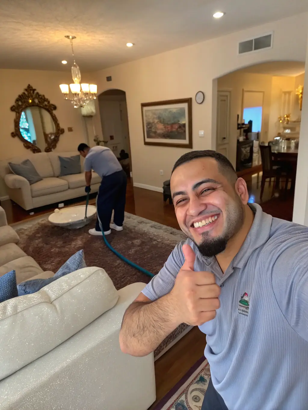 A customer testimonial photo featuring a satisfied client with a sparkling clean home, emphasizing the high level of service and personal follow-up provided by Fandlarenhold.