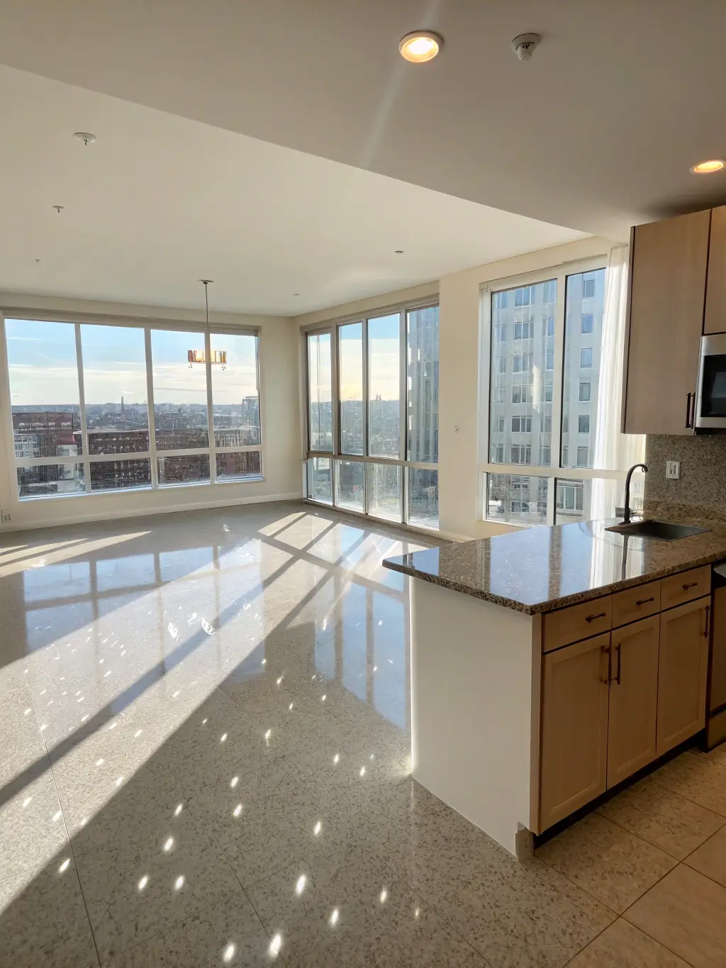 A photo of a spotless, empty apartment after a move-out cleaning service, showcasing clean floors and windows, ready for new tenants.